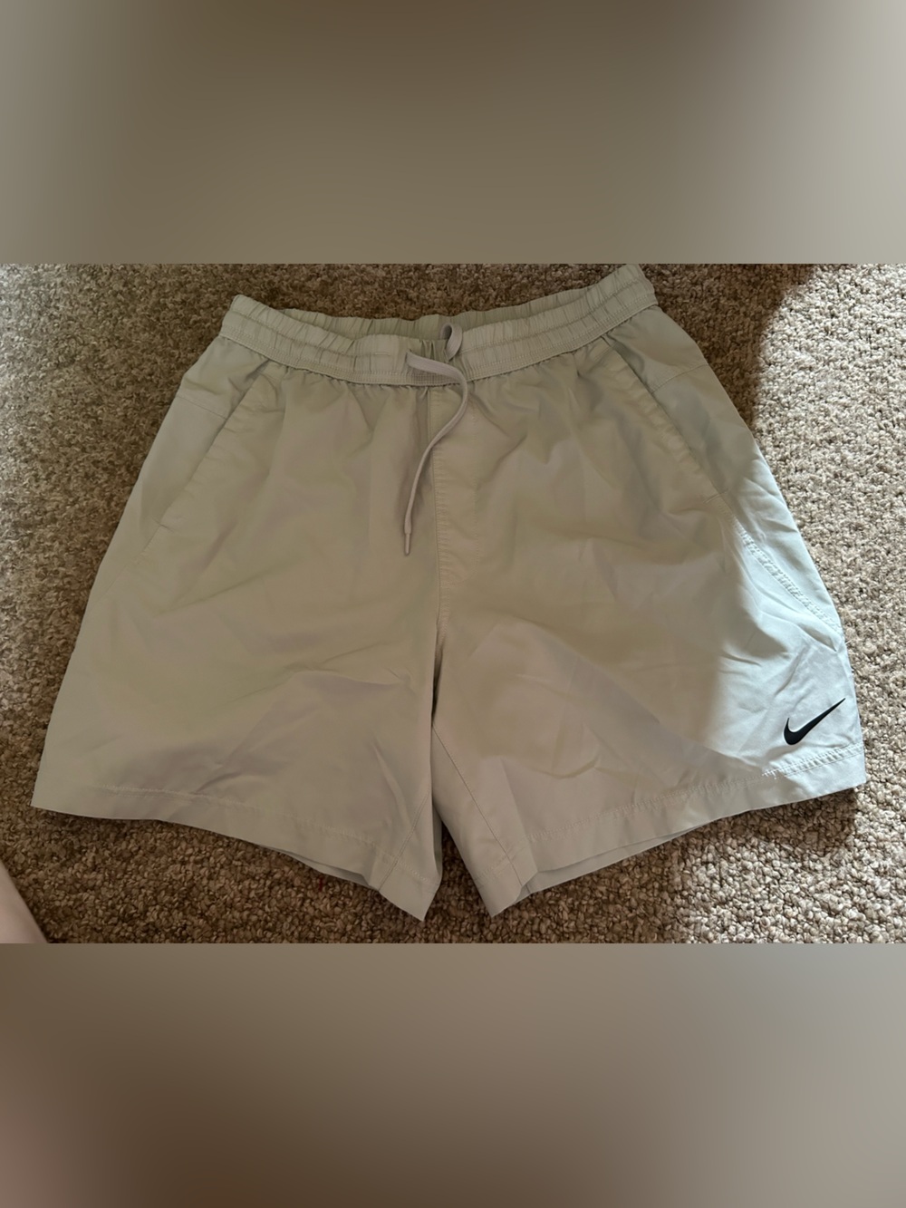 Nike Women's Light Beige Athletic Shorts with Black Swoosh